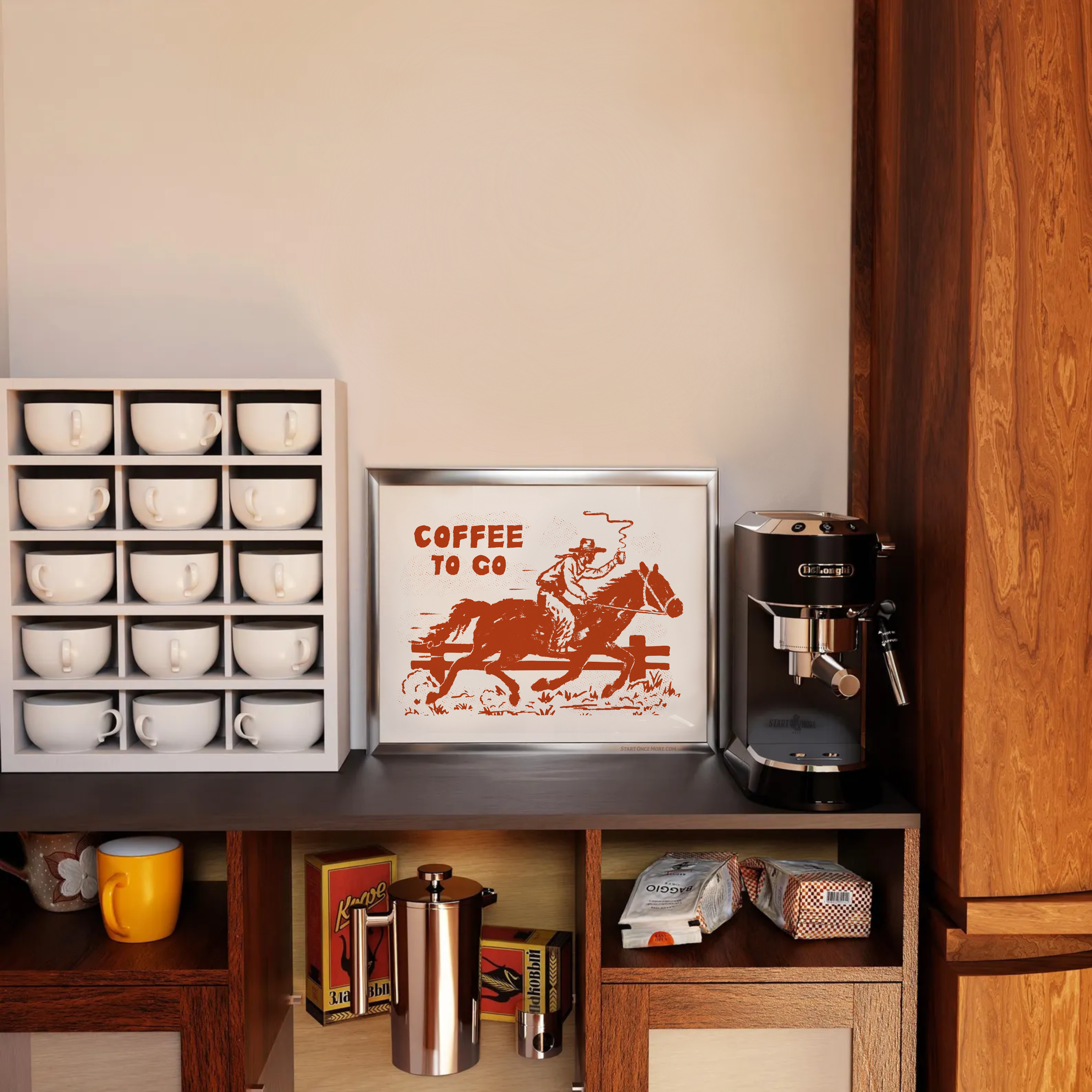 Coffee station with coffee machine, cups, and framed print on a wooden shelf, and coffee to go cowboy giclee art print on display